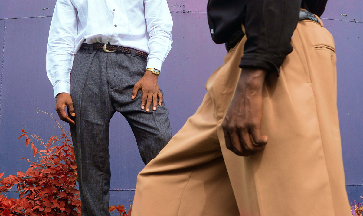 Pair of male models wearing gray and beige pants
