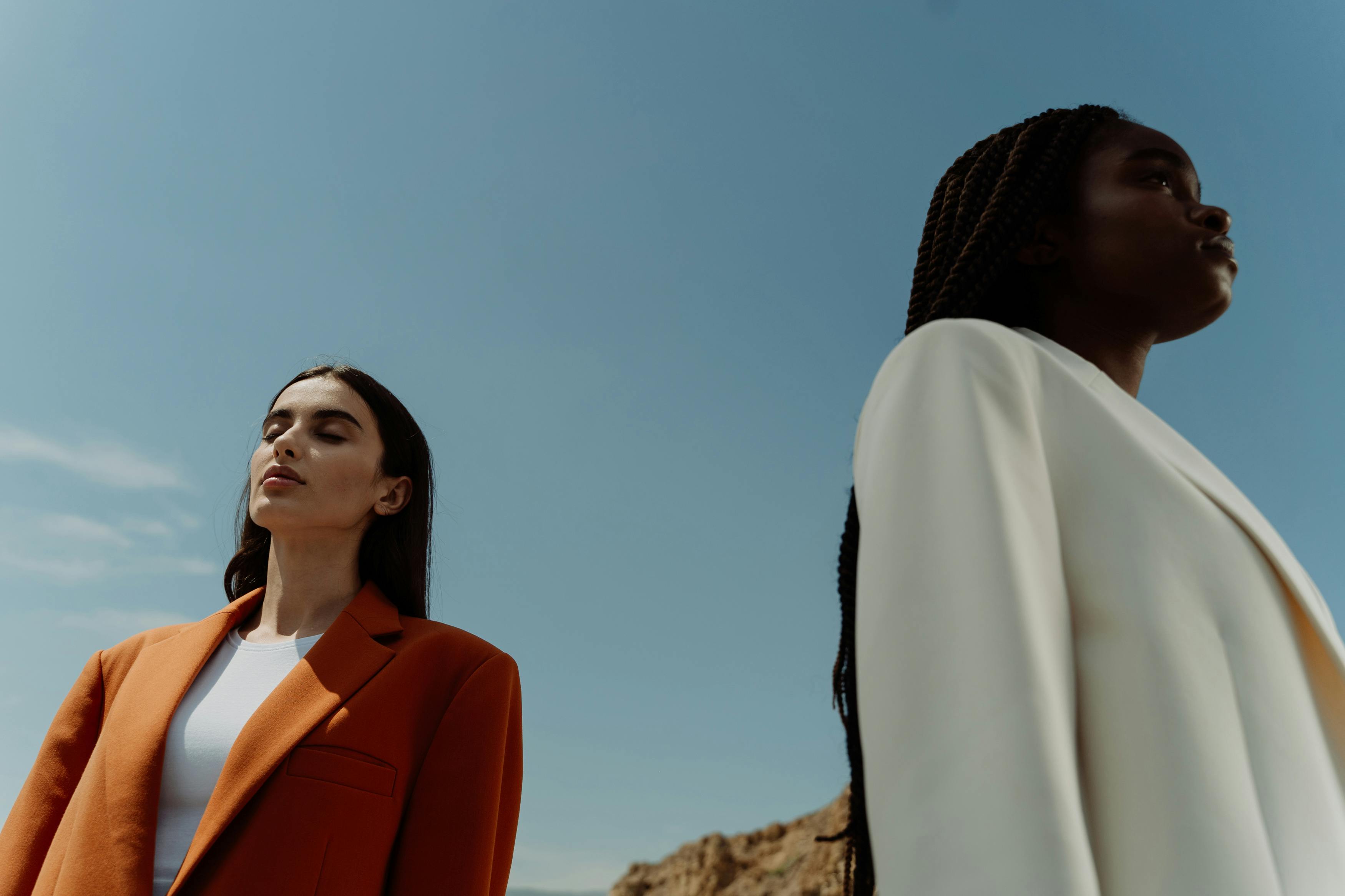 A pair of models facing in opposite directions